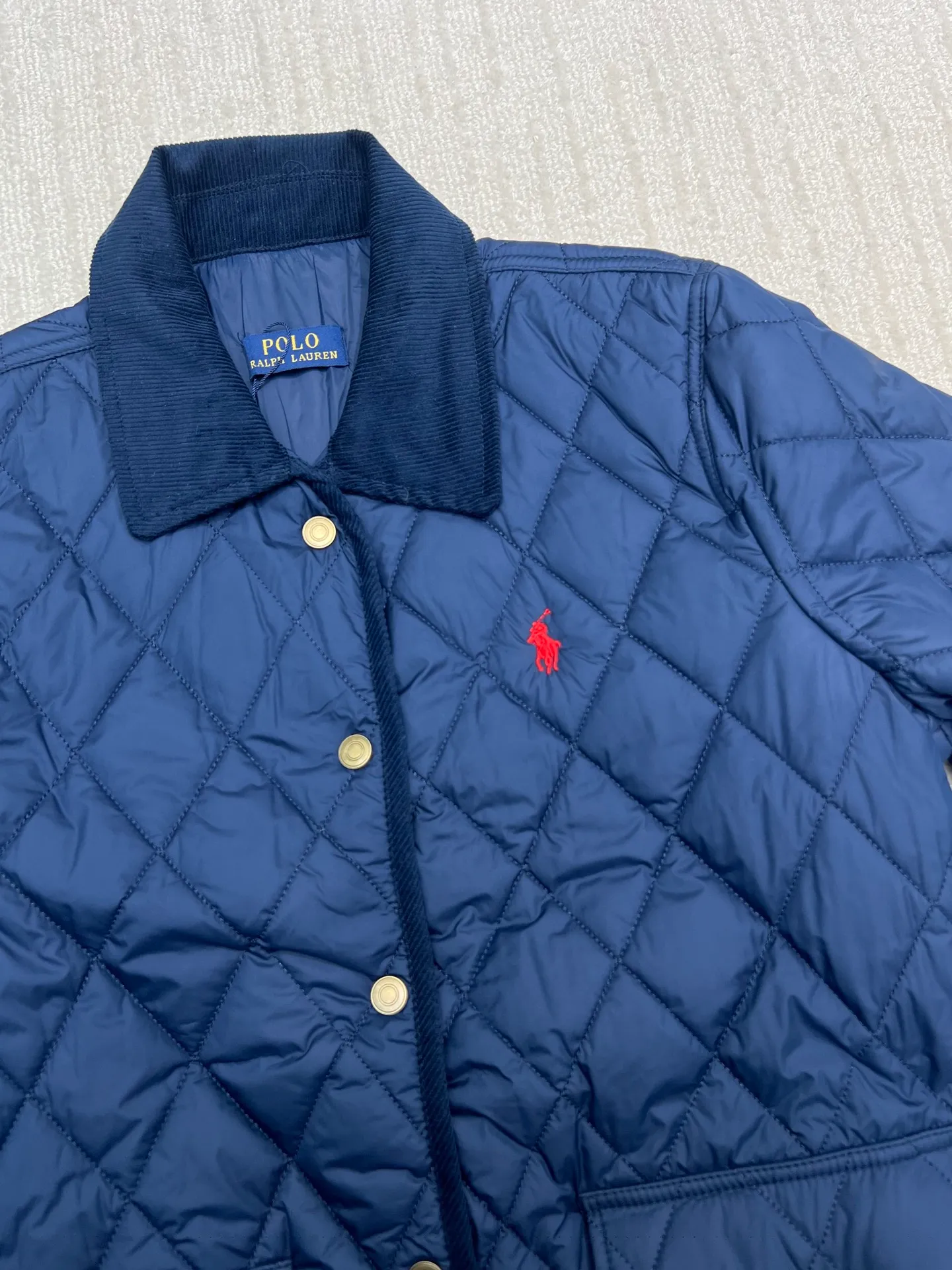 P350 Ralph Lauren logo embroidered diamond plaid corduroy cotton jacket. Exquisite small logo embroidery on the chest, corduroy color-blocked lapels, pocket design showing details, customized accessories, complete with three standards. Size: S M L XL
